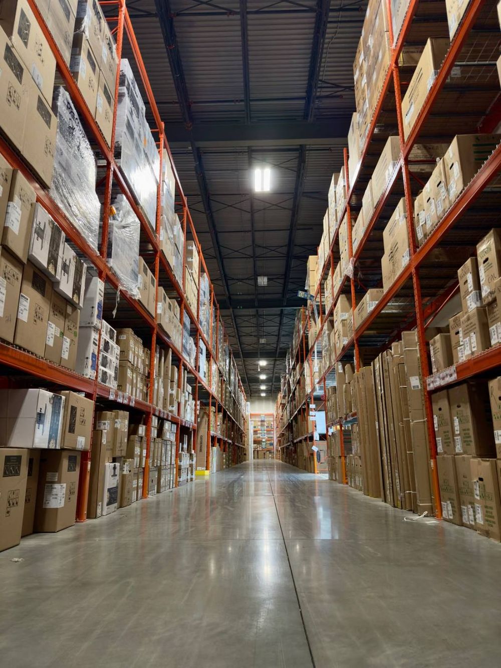Warehouse aisle stocked with cases of product